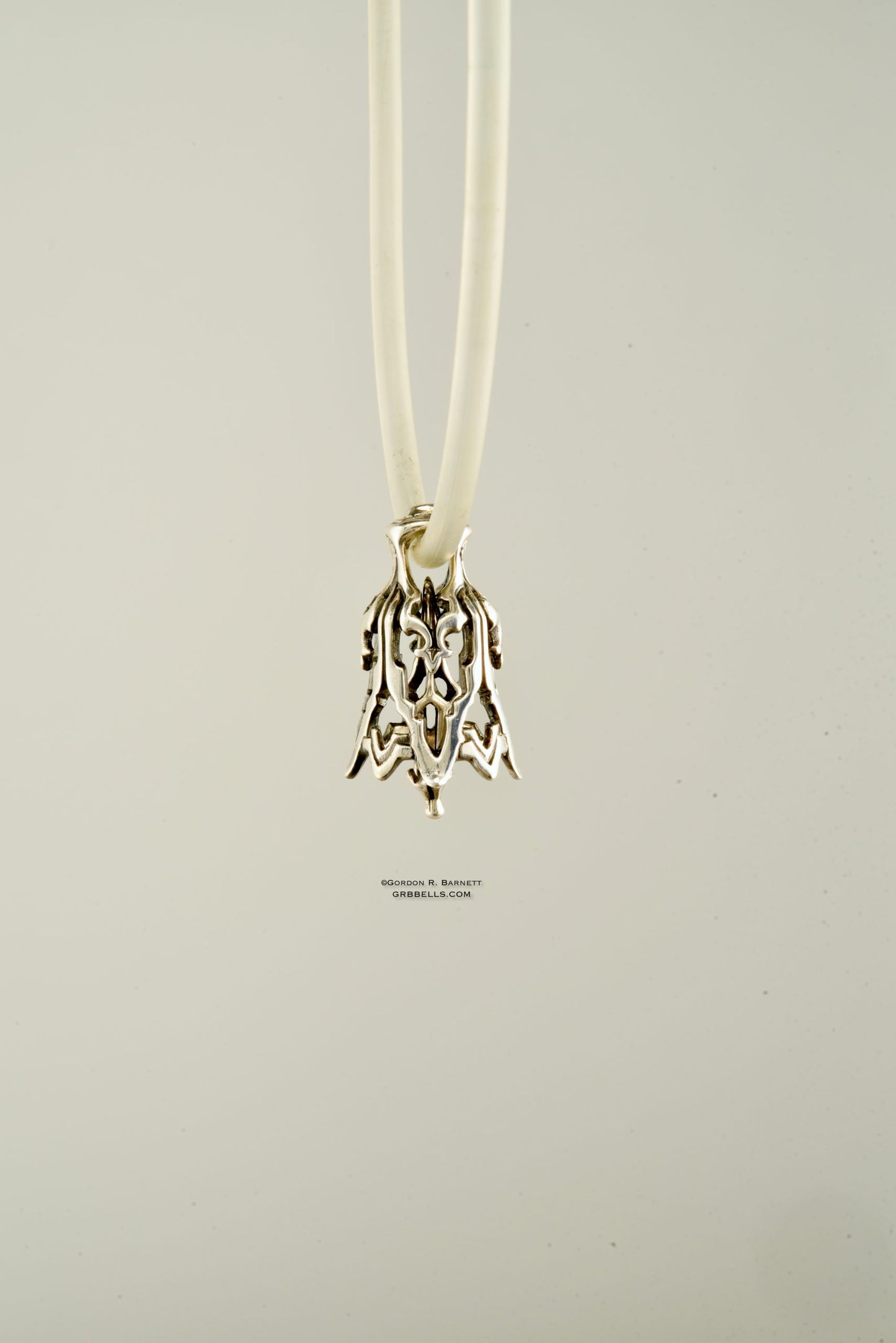 Alhambra bell jewelry necklace in sterling silver, side view architectural jewelry