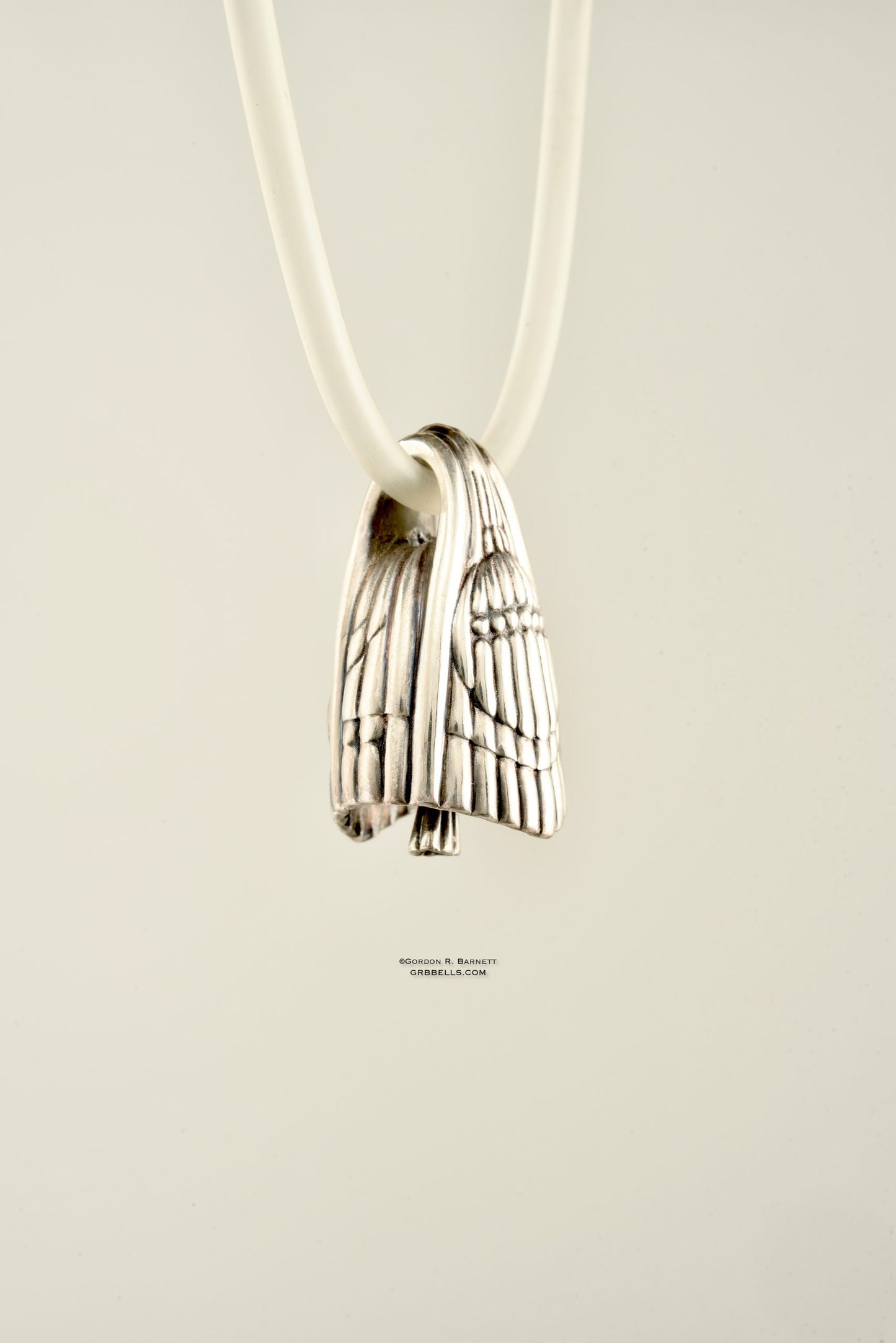 aurora jewelry bell necklace in sterling silver, three quarters view