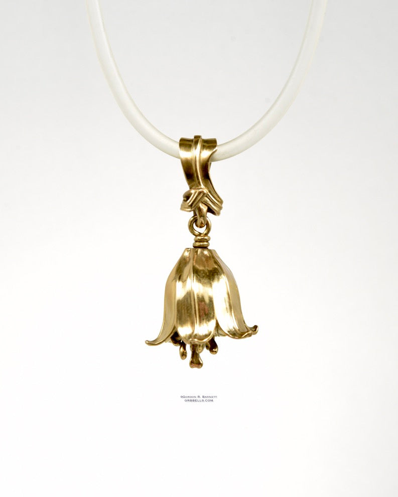 chocolate lily bell necklace in bronze is 47 mm tall. (front view) his handmade pendant is made with lost wax casting, then polished and assembled in Washington state. suitable for botanist gardener