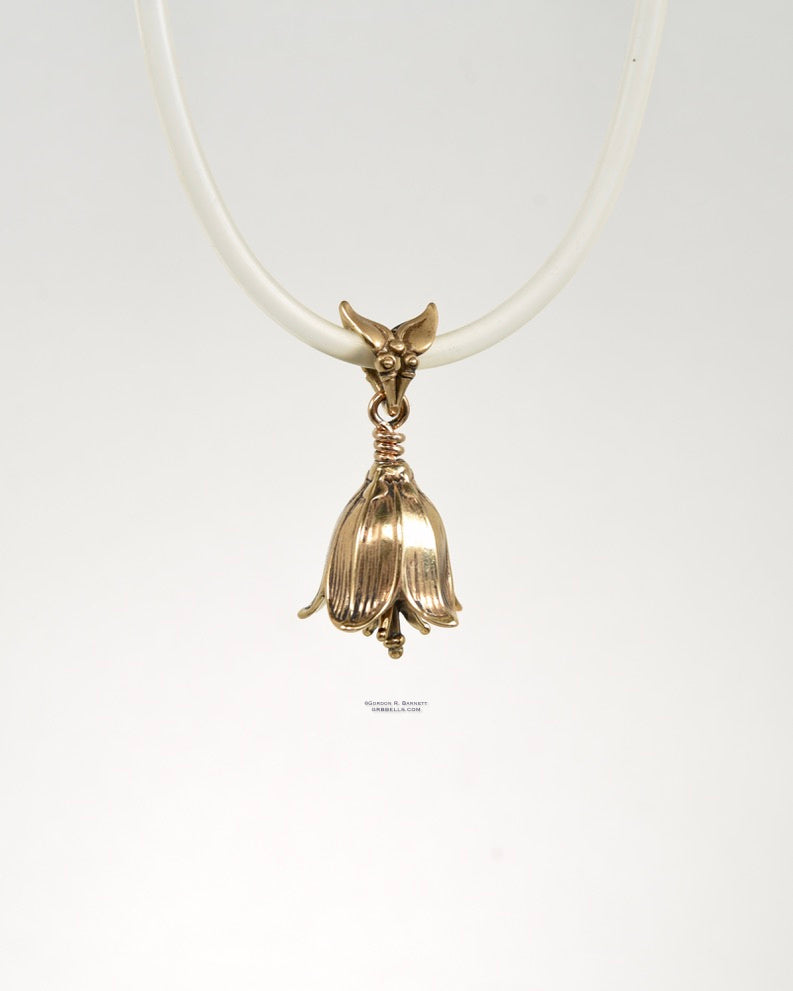 chocolate lily bell necklace in bronze is 30 mm tall. (front view) his handmade pendant is made with lost wax casting, then polished and assembled in Washington state. suitable for botanist gardener