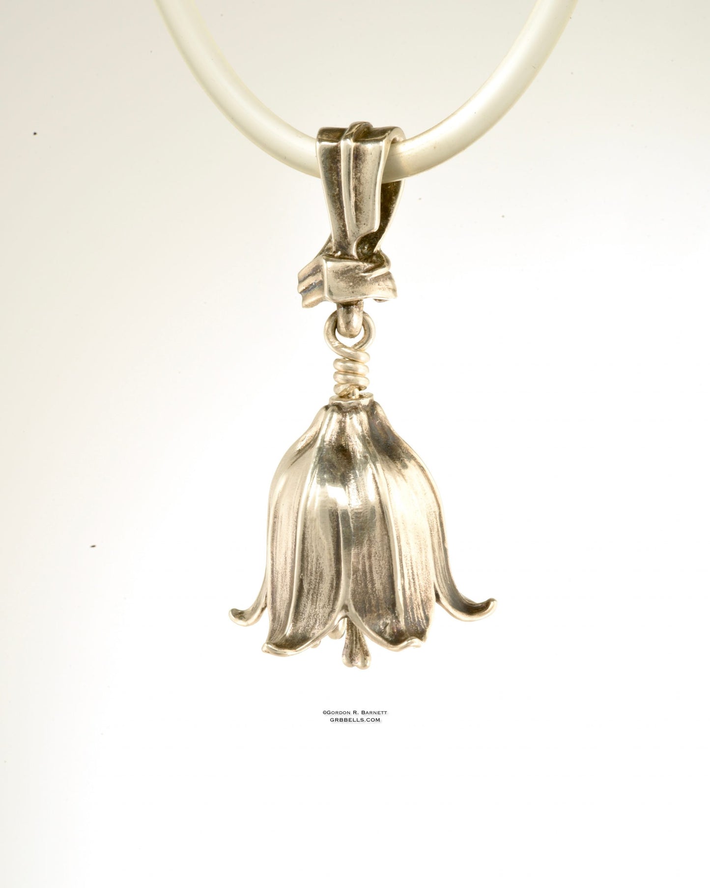 chocolate lily bell necklace in sterling silver is 47 mm tall. (back view) his handmade pendant is made with lost wax casting, then polished and assembled in Washington state. suitable for botanist gardener