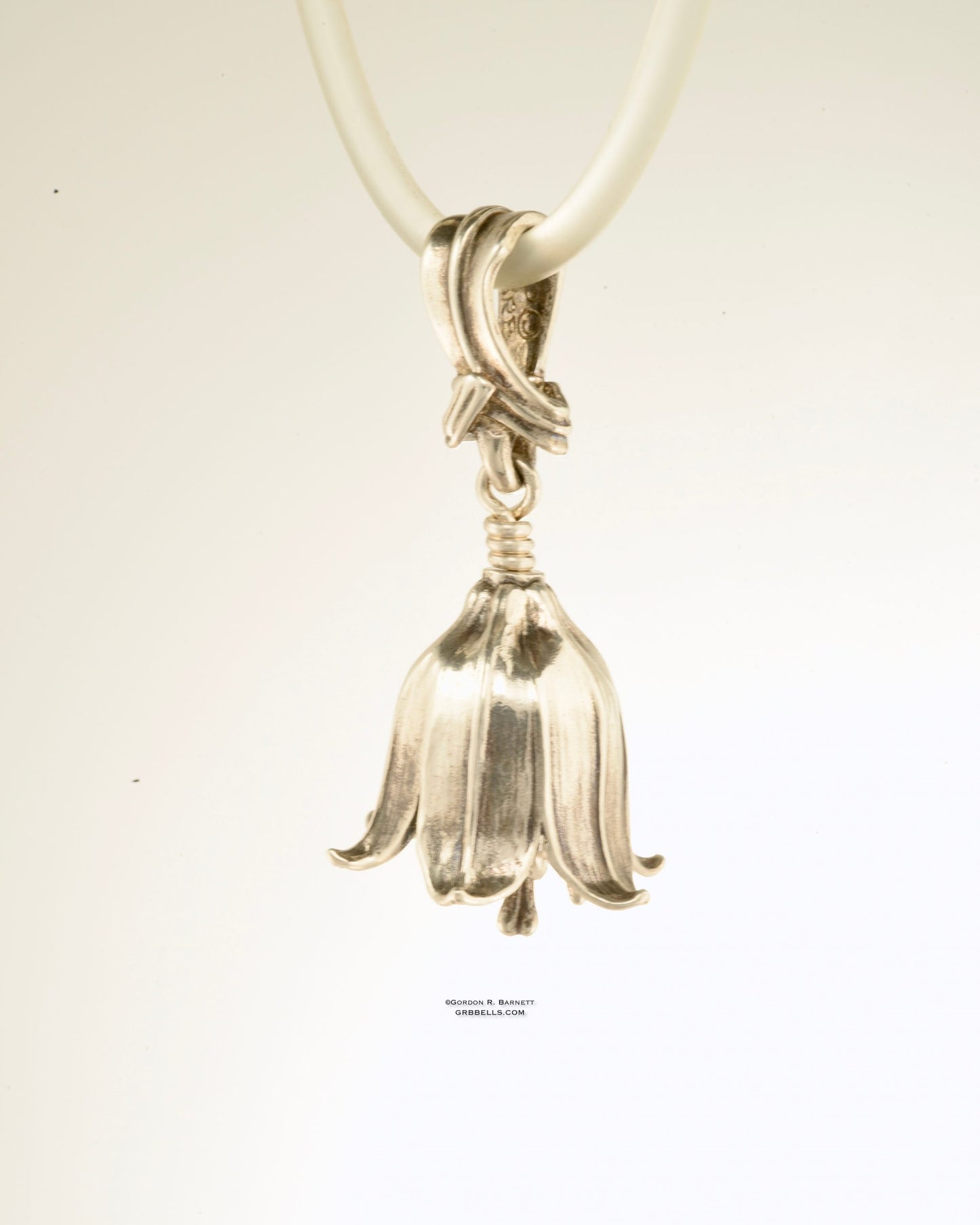 chocolate lily bell necklace in sterling silver is 47 mm tall. (three-quarter front right view) his handmade pendant is made with lost wax casting, then polished and assembled in Washington state. suitable for botanist gardener