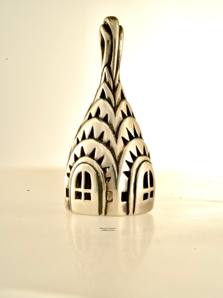 chrisler building bell necklace in sterling silver is 45 mm tall. (front view sitting) his handmade pendant is made with lost wax casting, then polished and assembled in Washington state. suitable for architect