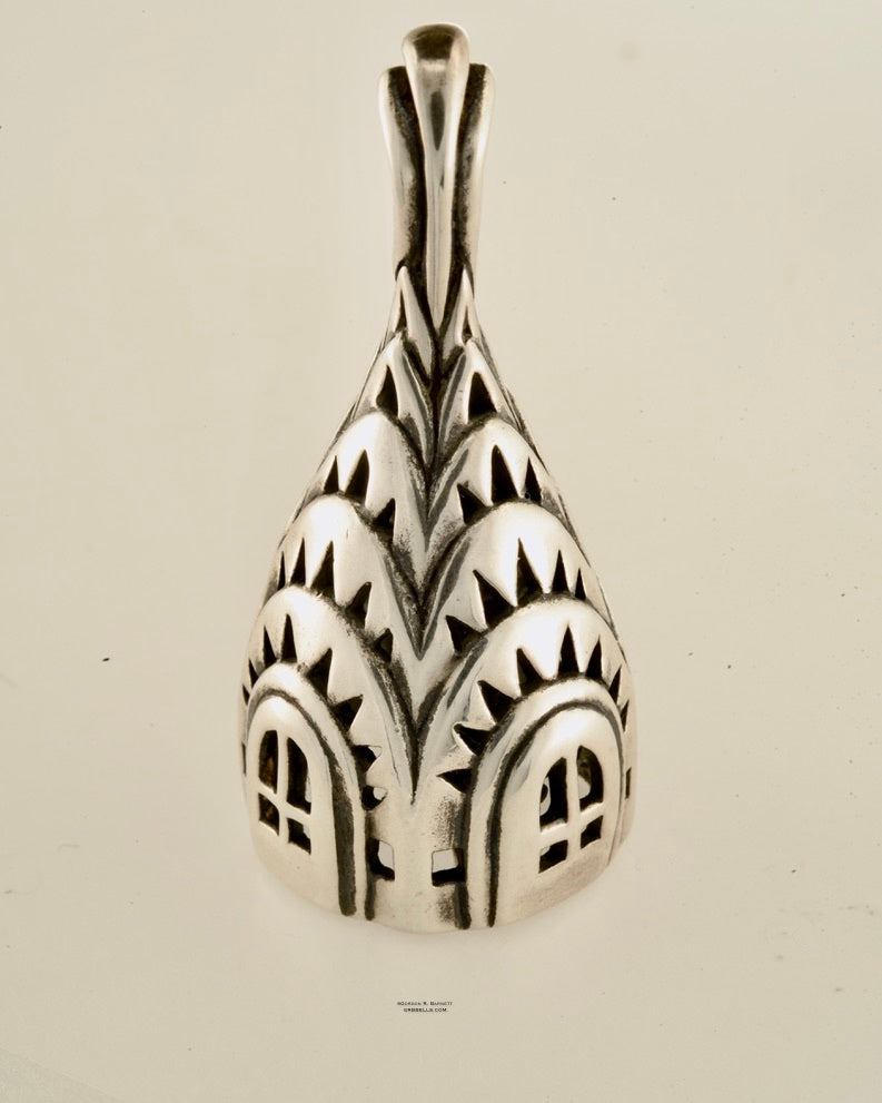 chrisler building bell necklace in sterling silver is 30 mm tall. (front view sitting) his handmade pendant is made with lost wax casting, then polished and assembled in Washington state. suitable for architect
