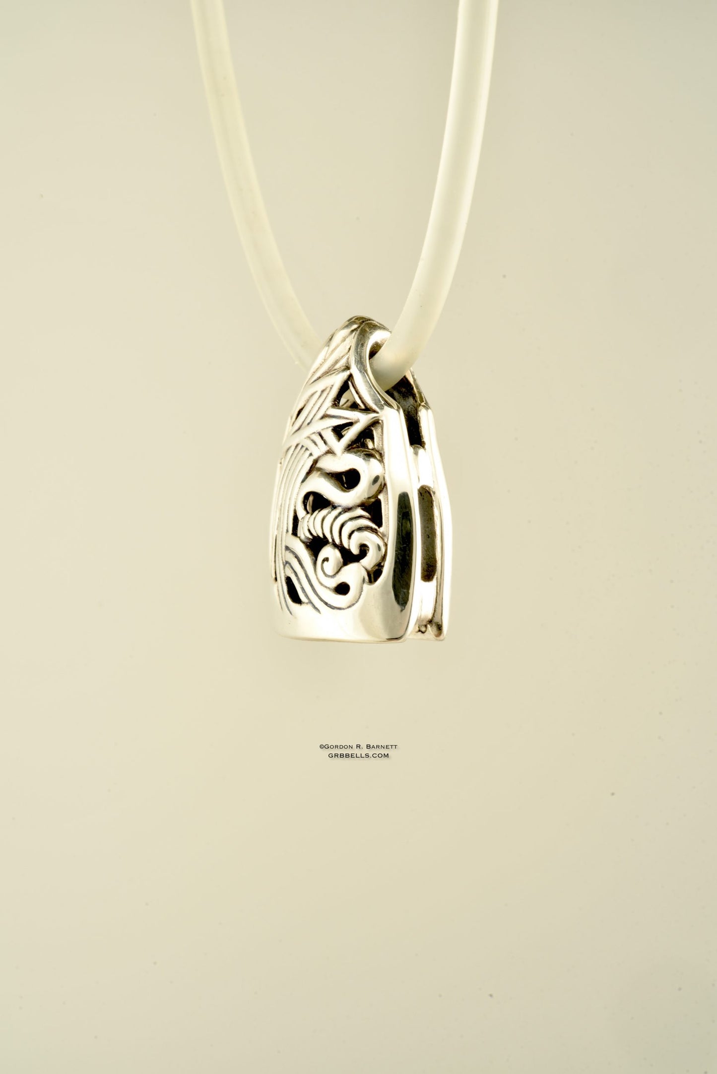 Necklace in Sterling silver is 28 mm tall (front three-quarter view). This handmade pendant is made with lost wax casting, then polished and assembled in Washington state. Suitable clarity inside storm