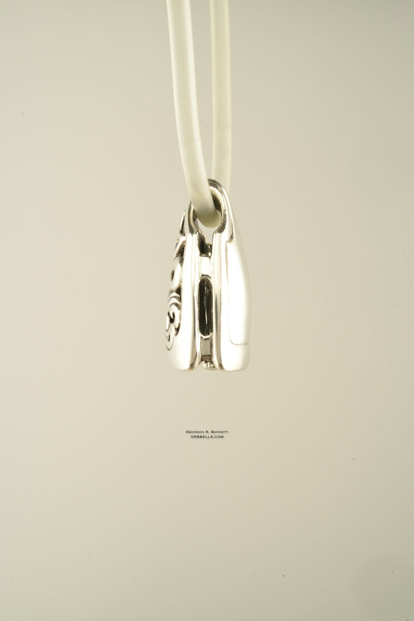Necklace in Sterling silver is 28 mm tall (side view). This handmade pendant is made with lost wax casting, then polished and assembled in Washington state. Suitable for clarity inside storm