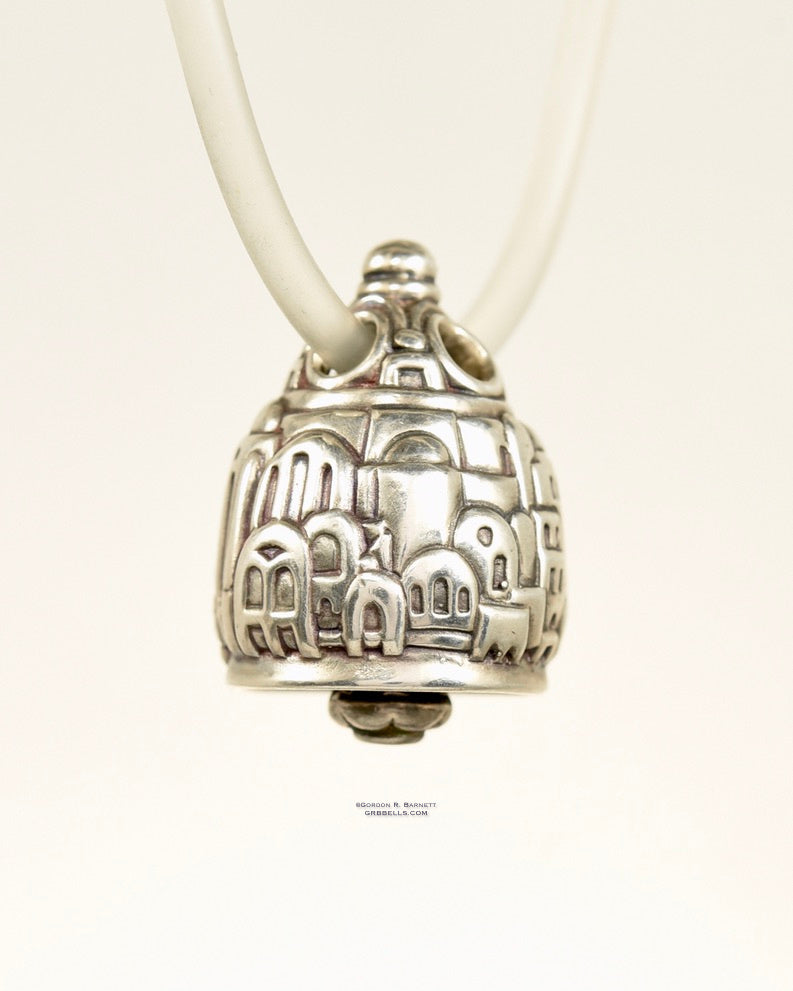 Necklace in Sterling silver is 25 mm tall (three-quarter view back right). This handmade pendant is made with lost wax casting, then polished and assembled in Washington state. Suitable for fantasy architect