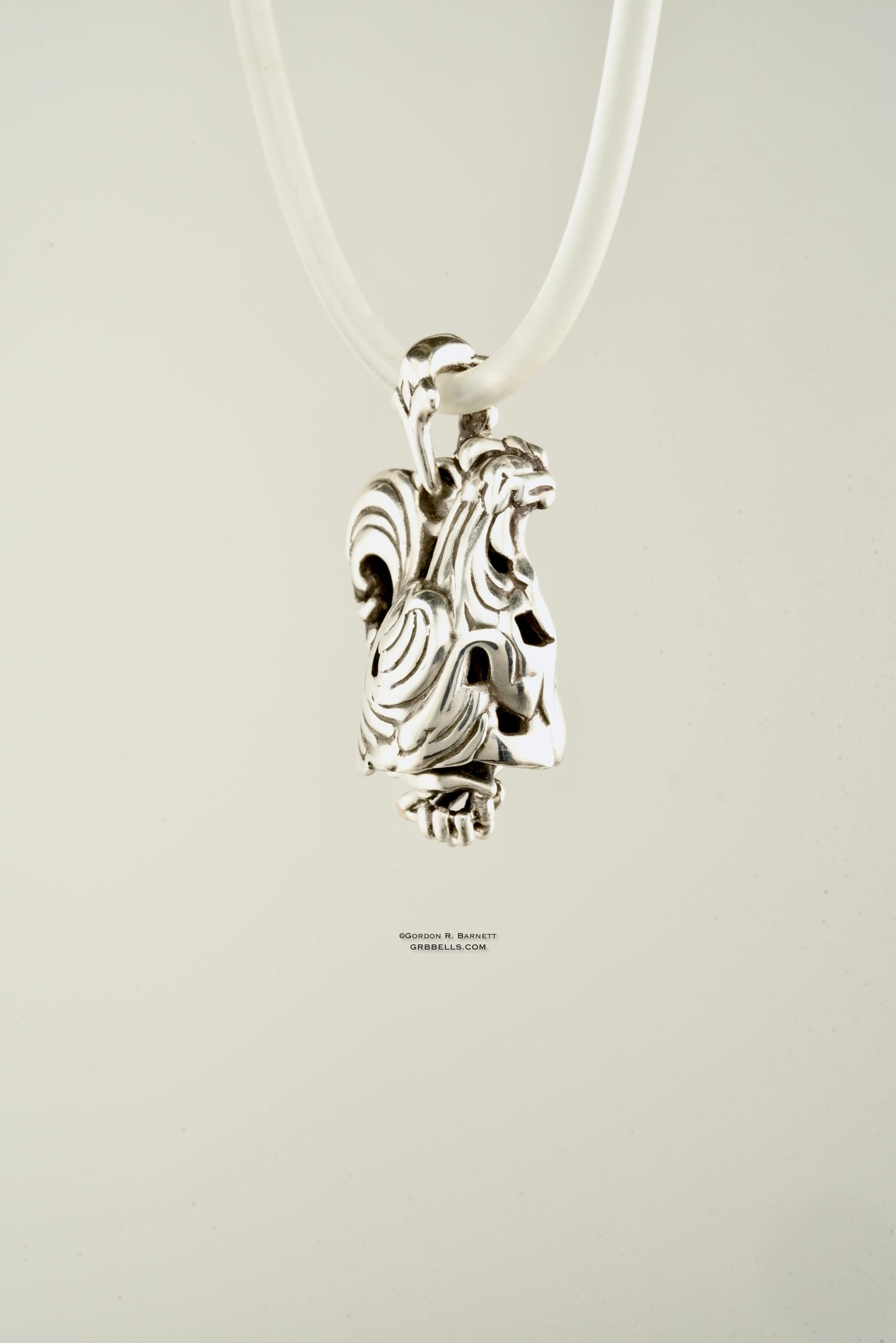 Coq/rooster jewelry bell necklace back three-quarter view is a handmade pendant in sterling silver is made with lost wax casting, then polished and assembled in Washington state perfect gift for rooster interest