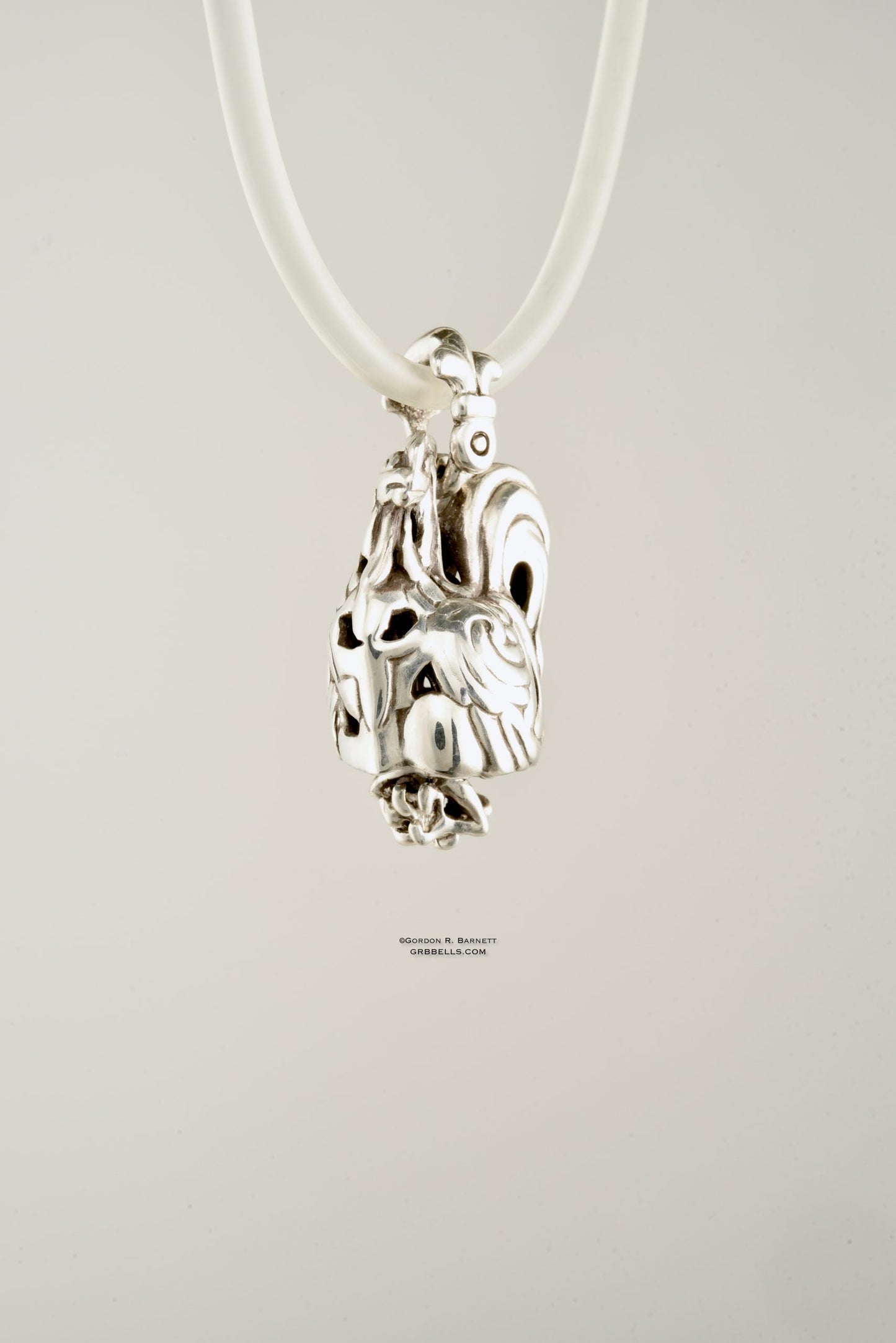 Coq/rooster jewelry bell necklace front three-quarter view is a handmade pendant in sterling silver is made with lost wax casting, then polished and assembled in Washington state perfect gift for rooster interest