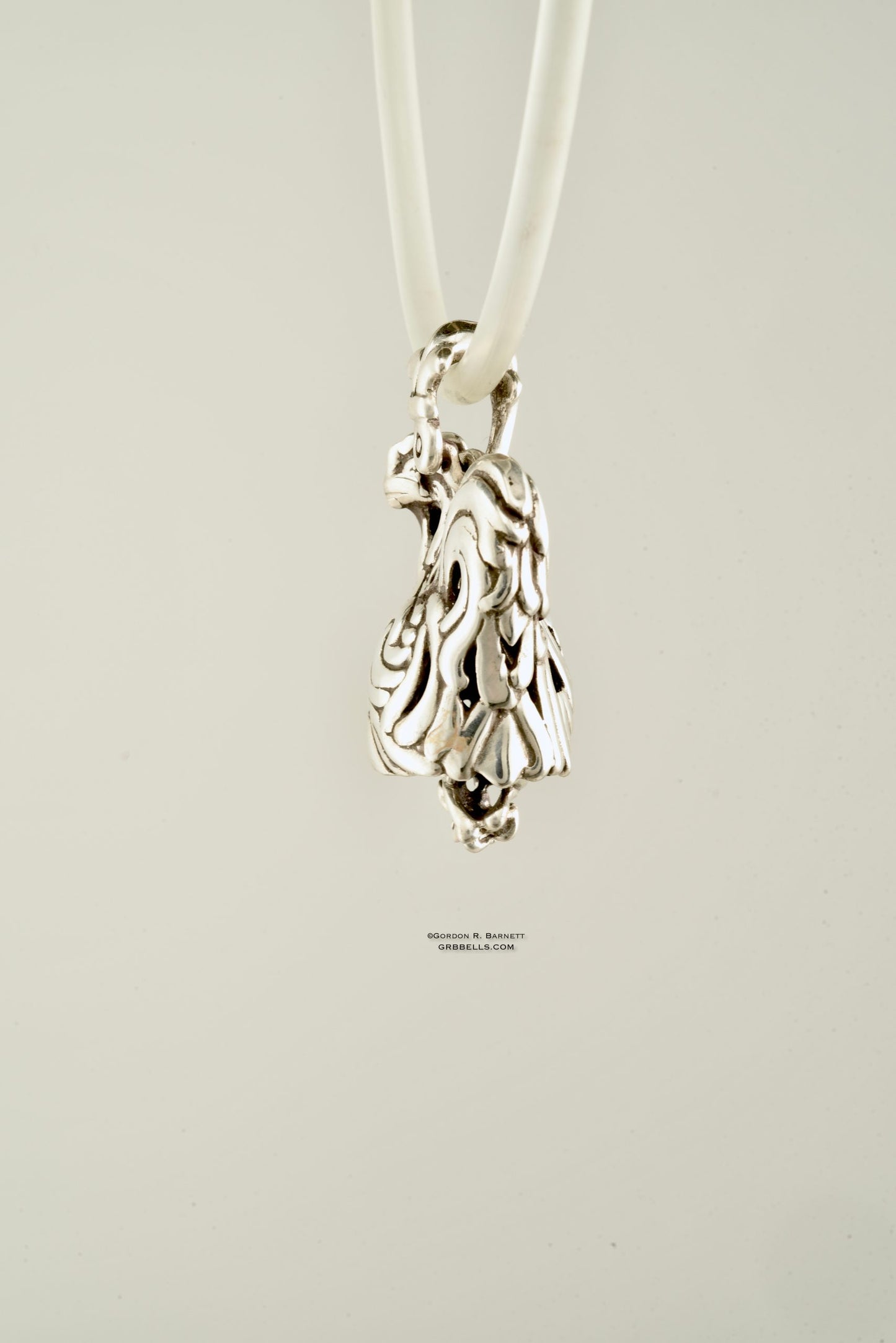 Coq/rooster jewelry bell necklace back three-quarter view is a handmade pendant in sterling silver is made with lost wax casting, then polished and assembled in Washington state perfect gift for rooster interest