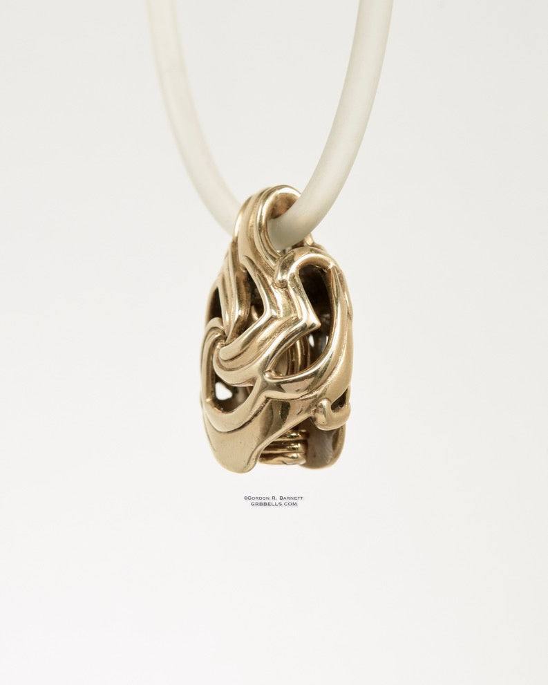 CELTIC TRISKELE jewelry bell necklace left three-quarter view in bronze is a handmade pendant in bronze is made with lost wax casting, then polished and assembled in Washington state perfect gift for celtic symbol