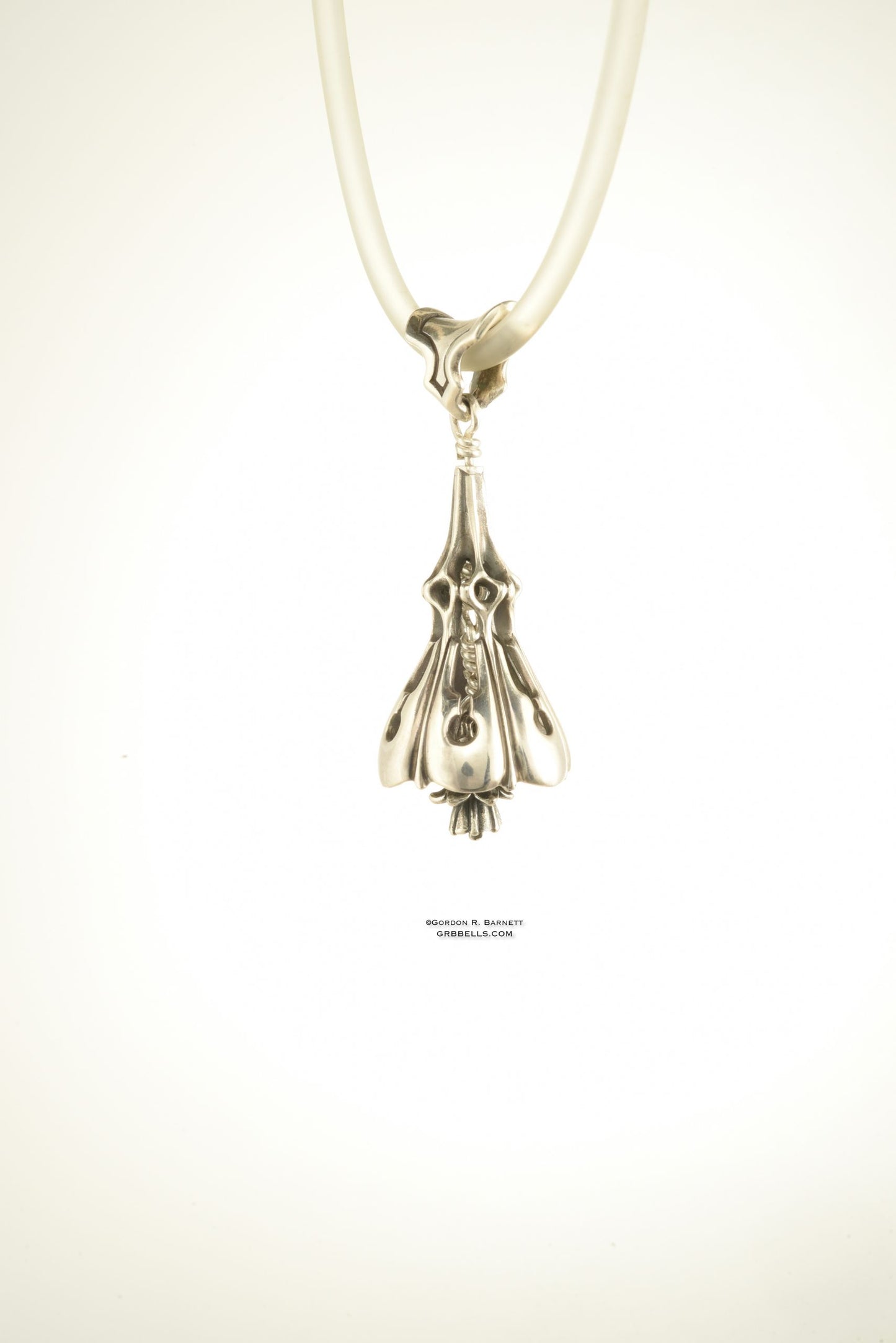 Bell Necklace in sterling silver is 47mm tall. (three=quarter view) This handmade pendant is made with lost wax casting, then polished and assembled in Washington state. suitable for gardener