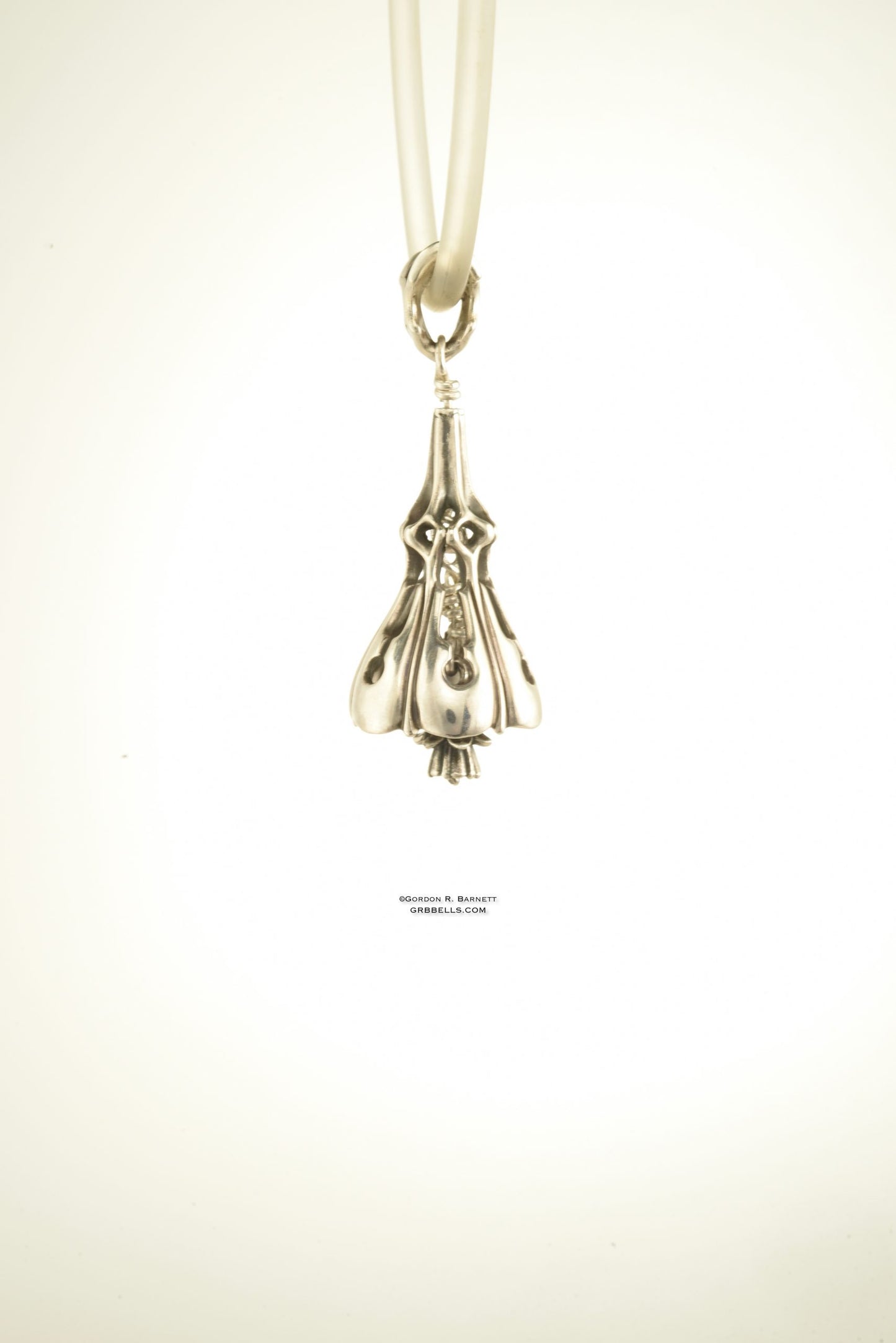 Bell Necklace in sterling silver is 47 mm tall. (three=quarter view) This handmade pendant is made with lost wax casting, then polished and assembled in Washington state. suitable for gardener
