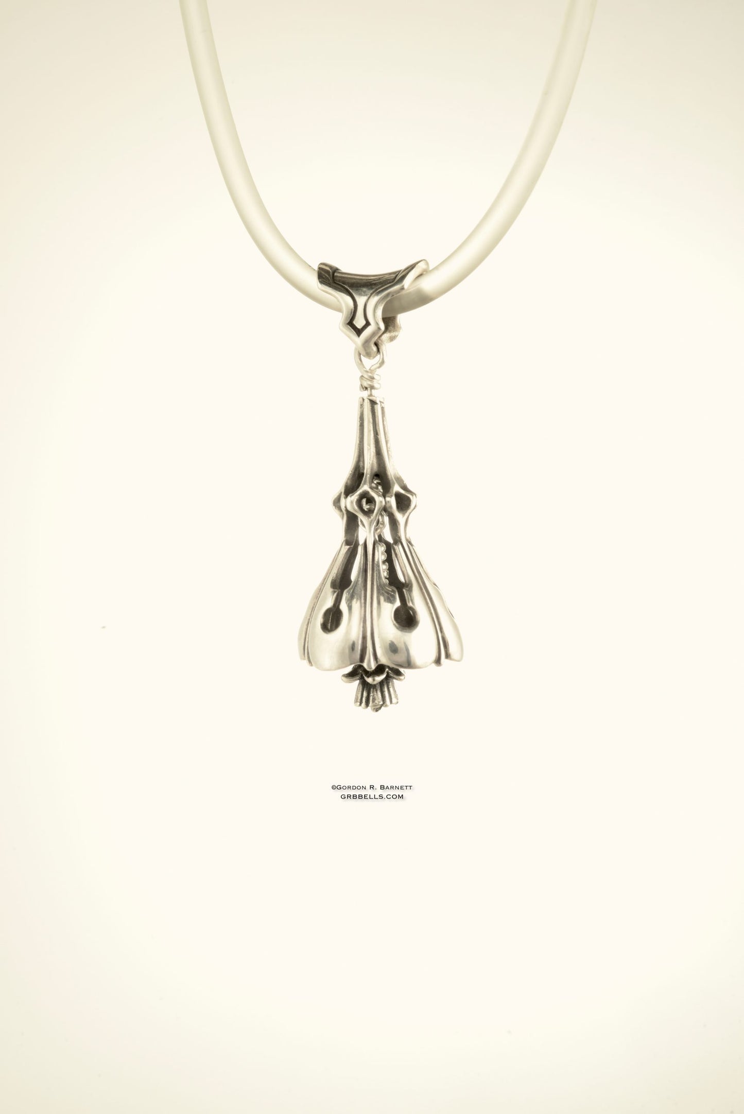 Bell Necklace in sterling silver is 47 mm tall. (side view) This handmade pendant is made with lost wax casting, then polished and assembled in Washington state. suitable for gardener