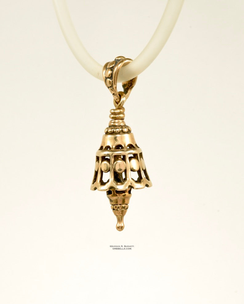 Dotted whispwe Bell Necklace in sterling silver is 30 mm tall, (right three-quarter view) This handmade pendant is made with lost wax casting, then polished and assembled in Washington state. suitable for quiet secret voices whispering truths