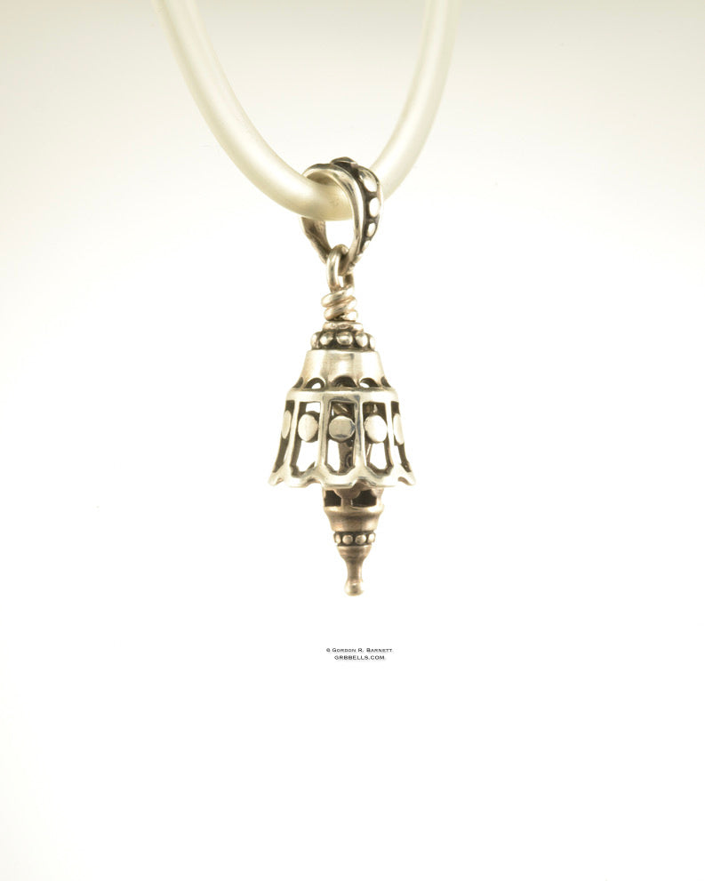 Dotted whispwe Bell Necklace in sterling silver is 30 mm tall, (right three-quarter view) This handmade pendant is made with lost wax casting, then polished and assembled in Washington state. suitable for quiet secret voices whispering truths
