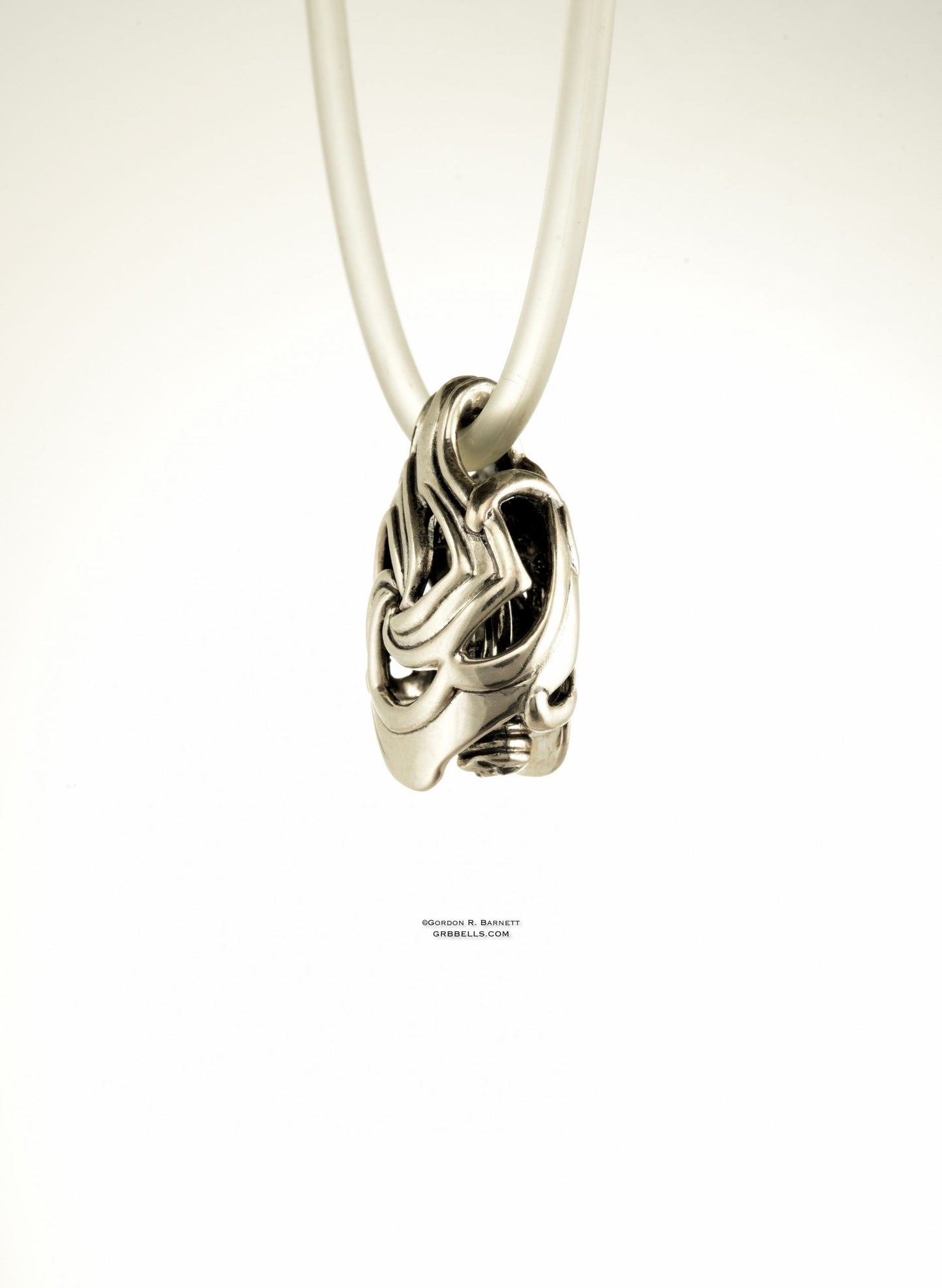 CELTIC TRISKELE jewelry bell necklace left three-quarter view in bronze is a handmade pendant in bronze is made with lost wax casting, then polished and assembled in Washington state perfect gift for celtic symbol